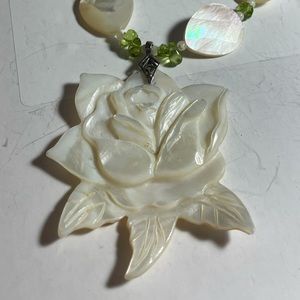 Carved shell flower necklace by Paulette